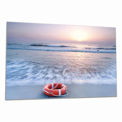 Produktbild von Wallario Herdabdeckplatte aus Glas, Größe 90 x 52 cm 1-teilig, Motiv Rettungsring am Strand bei Sonnenuntergang