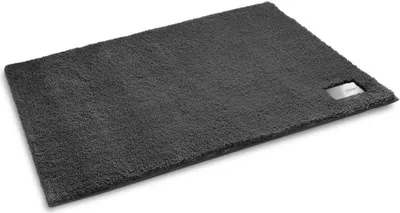A dark gray bath mat is shown on a white background.
