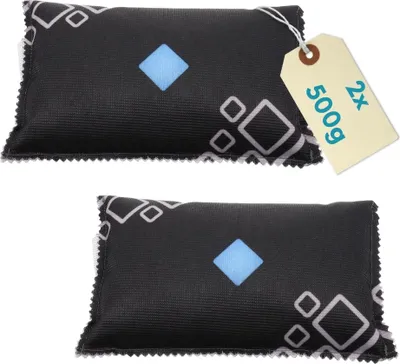 Two black dehumidifier bags with a geometric pattern and a blue diamond in the center, placed on a white background. A tan tag with text is attached to the top bag.