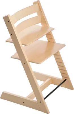 A wooden high chair against a white background.