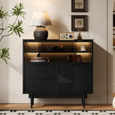 A black sideboard with LED lighting is displayed in a room setting, showcasing its design and storage capabilities.