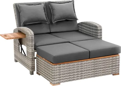 A grey outdoor sofa with a chaise lounge and a wooden side table.