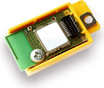 A close-up view of a circuit board inside a yellow casing.