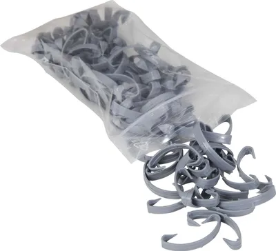 A bag of gray plastic clips spilling out onto a white background.