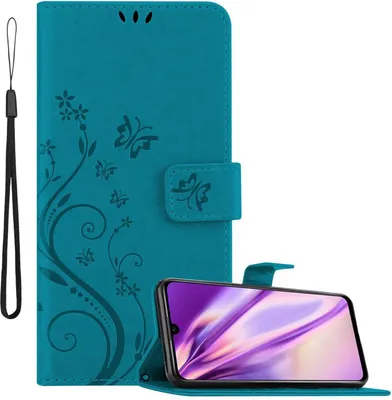 A teal flip phone case with a floral and butterfly design is shown open, with a smartphone inside. A black wrist strap is attached to the side of the case.