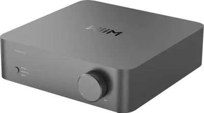 A studio shot of a gray audio amplifier.