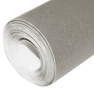 A roll of grey fabric with a velvety texture, partially unrolled.