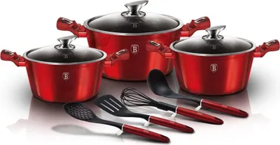 A set of red cookware and utensils is displayed on a white background.