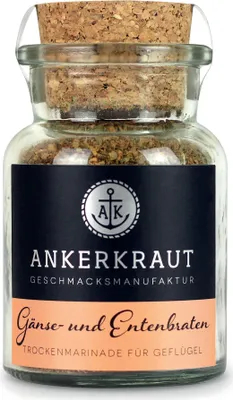 A glass jar filled with seasoning, sealed with a cork, and featuring a label.