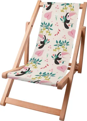A wooden deck chair with a fabric seat featuring a toucan and floral pattern.