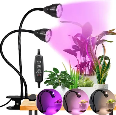 A clip-on grow light with two adjustable arms and LED bulbs, illuminating several potted plants with purple light. The image also includes inset circular views of the light in different modes.