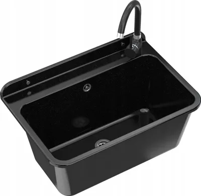 A black sink with a faucet, shown from a slightly elevated angle.