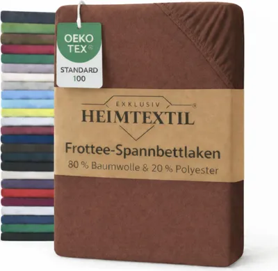 A folded bed sheet with a product label and a stack of other colored bed sheets in the background.
