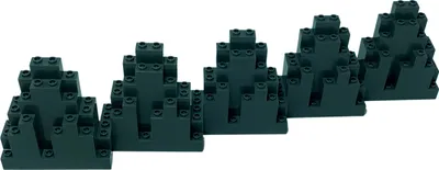 Several dark gray LEGO brick structures resembling mountains or rocky outcrops are arranged in a diagonal line against a white background.