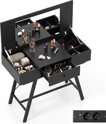 A black vanity table with a mirror and various makeup items, shown from a slightly elevated angle.