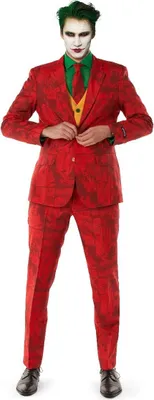 A man wearing a red suit with a green shirt and yellow vest, styled as the Joker.