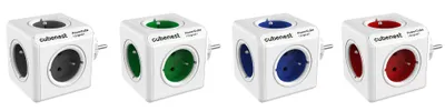 Four white cube-shaped power adapters with different colored outlets are arranged in a row on a white background.