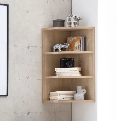 A corner shelf unit with decorative items and books.
