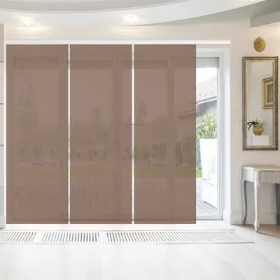 A room interior with large sliding panel curtains covering a window or door, with a console table and mirror on the right.