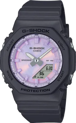 A close-up studio shot of a black Casio G-Shock watch with a purple and pink iridescent dial.