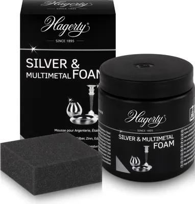 A box, a jar of foam cleaner, and a sponge for cleaning silver and other metals are displayed against a white background.