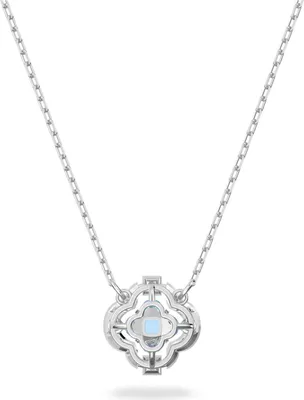 A silver necklace with a clover-shaped pendant featuring a blue crystal.