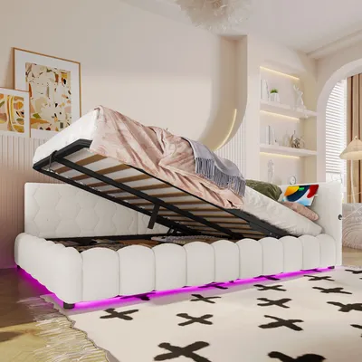 A bedroom scene with a white bed frame that has its mattress lifted, revealing storage space underneath. The bed has LED lighting along its base.