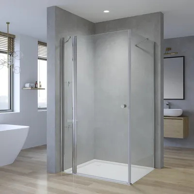 A modern bathroom with a shower enclosure, bathtub, and vanity.