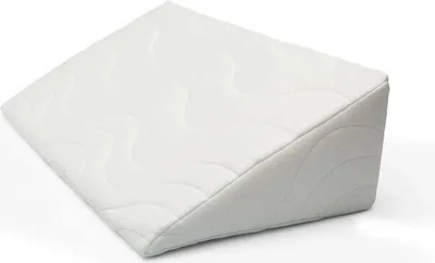 A white wedge pillow on a white background.