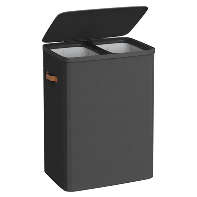 A dark gray laundry basket with two compartments, a lid, and brown handles is shown against a white background.