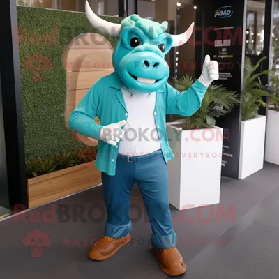 Productafbeelding van Turquoise Bull mascotte REDBROKOLY kostuum karakter gekleed met een spijkerbroek en pochetten