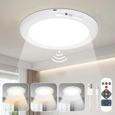 A white LED ceiling light with a motion sensor and remote control is shown mounted on a white ceiling. The light is emitting a beam downwards. Below the main image, there are three smaller inset images showing the light with different color temperatures. T