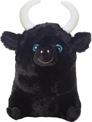 A plush toy bull sitting down.