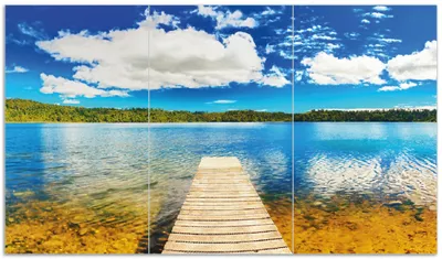 Produktbild von Wallario Herdabdeckplatte aus Glas, Größe 90 x 52 cm 3-teilig, Motiv Klarer See mit Steg - Blauer Himmel