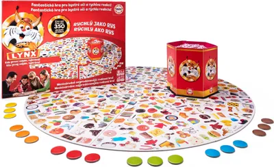 A board game called LYNX is laid out on a white surface, with its box and components visible.