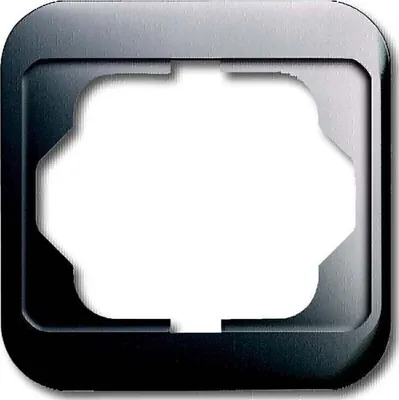 A close-up of a single electrical outlet frame with a metallic finish.