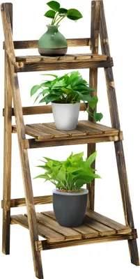 A three-tiered wooden plant stand with plants on each tier.