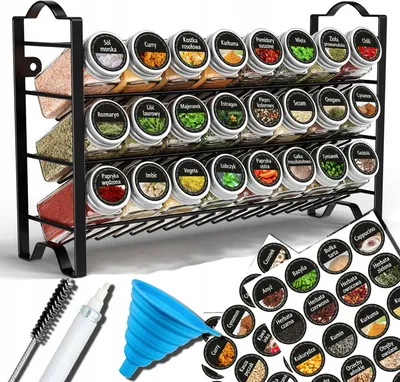 A spice rack with multiple shelves filled with spice jars, along with a collection of circular labels and a blue funnel.