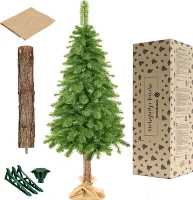 A collection of items for assembling an artificial Christmas tree, including the tree itself, a natural log base, a jute sack, and a stand.