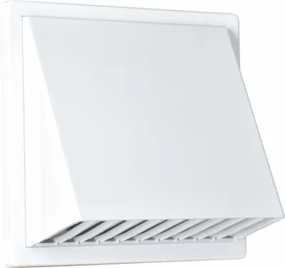 A white ventilation grille with a hood is mounted on a white wall.
