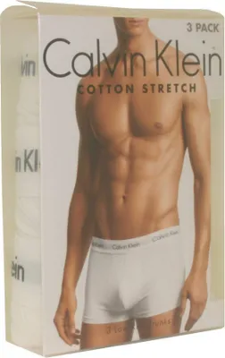 A man wearing Calvin Klein boxer briefs is shown on the packaging of a 3-pack of cotton stretch boxer shorts.