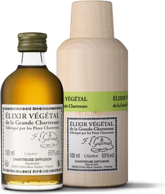 Two bottles of Chartreuse Elixir Vegetal are displayed against a white background. One bottle is a standard glass bottle with a green cap and a label, while the other is a larger, wooden-encased bottle with a similar label.