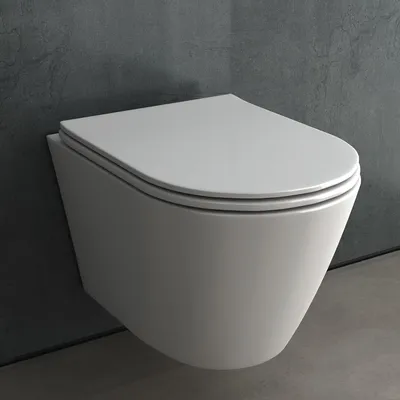 A modern wall-mounted toilet with a closed lid, set against a textured gray wall and a concrete floor.