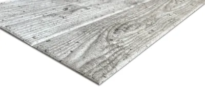 A close-up, angled view of a decorative foam panel with a wood grain and concrete texture.