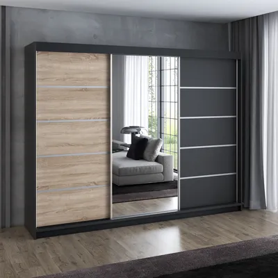 A modern sliding door wardrobe with a wood-effect door and mirrored doors, set in a room with a concrete wall and wooden floor.
