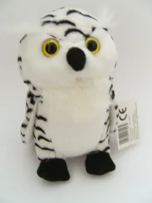 A plush toy owl is shown against a white background.