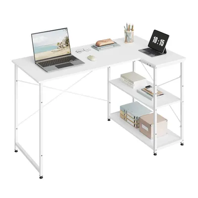 A white L-shaped desk with shelves, featuring two laptops, a mouse, glasses, and books.