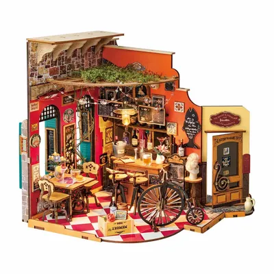 A miniature diorama of a bar/restaurant scene, with detailed furniture, decorations, and a bicycle.