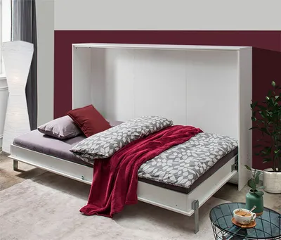 A white murphy bed is shown in the open position, with bedding and pillows.