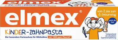 A box of Elmex children's toothpaste with a cartoon mouse character.
